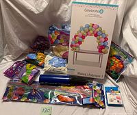 All items grouped showing arch kit box, balloon packs, pump, sticks and glue dots