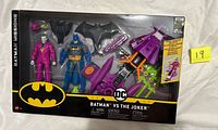 Front of sealed Batman Missions Batman vs The Joker box showing contents through window