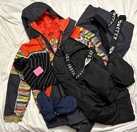 All items together: jacket, snow pants, mittens, hat