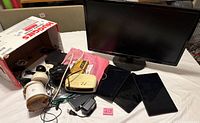 Entire lot showing monitor, tablets, cameras, multimeter, modem, cords