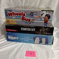 Stacked view of all three game boxes