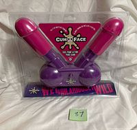 Front of sealed Cum Face pump action penis party game in packaging