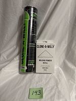 Front view of sealed kit tube and refill box