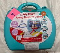 Front of turquoise carry case with product label