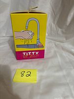 Front of Titty Soap box showing faucet graphic