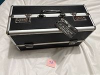 Front angle of black locking storage case with tag attached