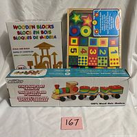 All three boxed wooden toy sets
