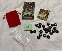 Entire set laid out: stones, pouch, cloth, box, booklet