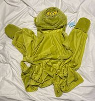 Front view showing Grinch hood, attached mitts, overall blanket