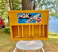 Front view showing NGK logo decal, open bay and dividers