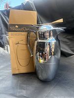 Carafe beside original box