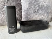 Front view of Pafish N1 power bank beside carrying case