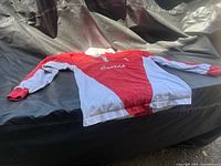 Full view of front of red and white rugby jersey