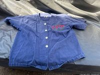 Full view of front of navy OPP jersey