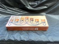 Closed retail box showing product image of 7-cup votive runner