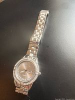 Front view of watch showing dial, bezel, and bracelet