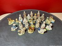 Front group view of 24 Wade porcelain figurines