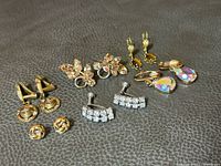 All six pairs arranged on leather surface showing overall lot