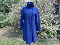 Full front view of royal blue Ella B. coat on hanger outside