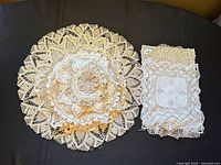 Stack of nested round doilies beside stack of rectangular doilies