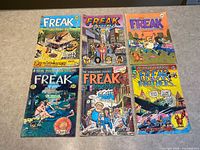 All six comic books laid out front covers visible