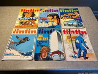 All six magazines laid out front covers visible