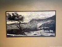 Front view of framed grayscale oil painting on wall