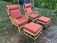 pair of rattan chairs with ottomans, front view