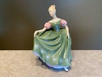 Front view of Michele figurine showing gown color and starburst detailing