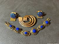 Group shot showing brooch, cufflinks and bracelet