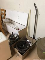 Canister vacuum, hose, wand and accessories in tote