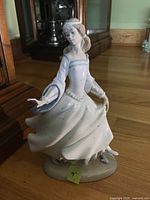 Front view of Lladro figurine showing full pose and dress