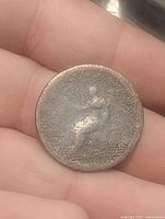 Obverse of 1806 copper halfpenny, worn bust of George III