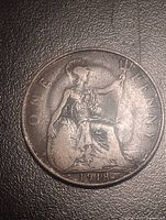 Reverse of 1918 penny showing Britannia and error blob near date