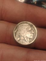 Obverse view with Native American profile and 1927 date