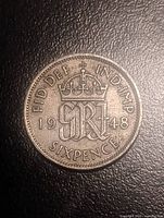 Reverse of 1948 sixpence showing crowned monogram, date and denomination