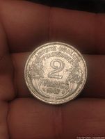 Reverse showing 2 FRANCS 1947 with olive branches