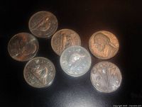 Obverse sides of seven coins