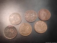 Reverse sides showing dates 1935, 1920, 1937, 1940, 1947; obverse of one coin