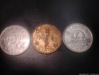 Obverse sides showing designs and dates