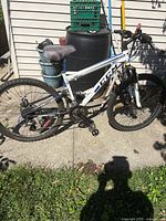 Left side view of complete CCM mountain bike showing frame, wheels, drivetrain, suspension fork