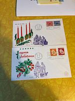 Both Christmas first day covers showing cachets, stamps and postmarks