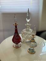 All three perfume bottles shown together