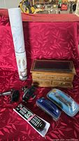 Group shot showing jewelry box, Norwex pet hair remover, two RCA remotes, two phone mounts and decal roll