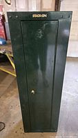 Front view of Stack-On green steel cabinet, closed door