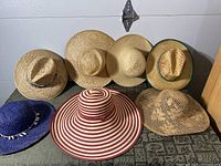 All seven hats arranged; shows styles and colours
