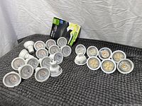 Group of all 23 GU10 LED bulbs arranged on mat