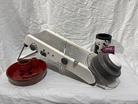 Mandoline slicer, ceramic dish with cups, Swig can cooler