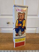 Front view of boxed Ernest the Balancing Bear toy