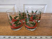 Four holly and ivy decorated lowball glasses
